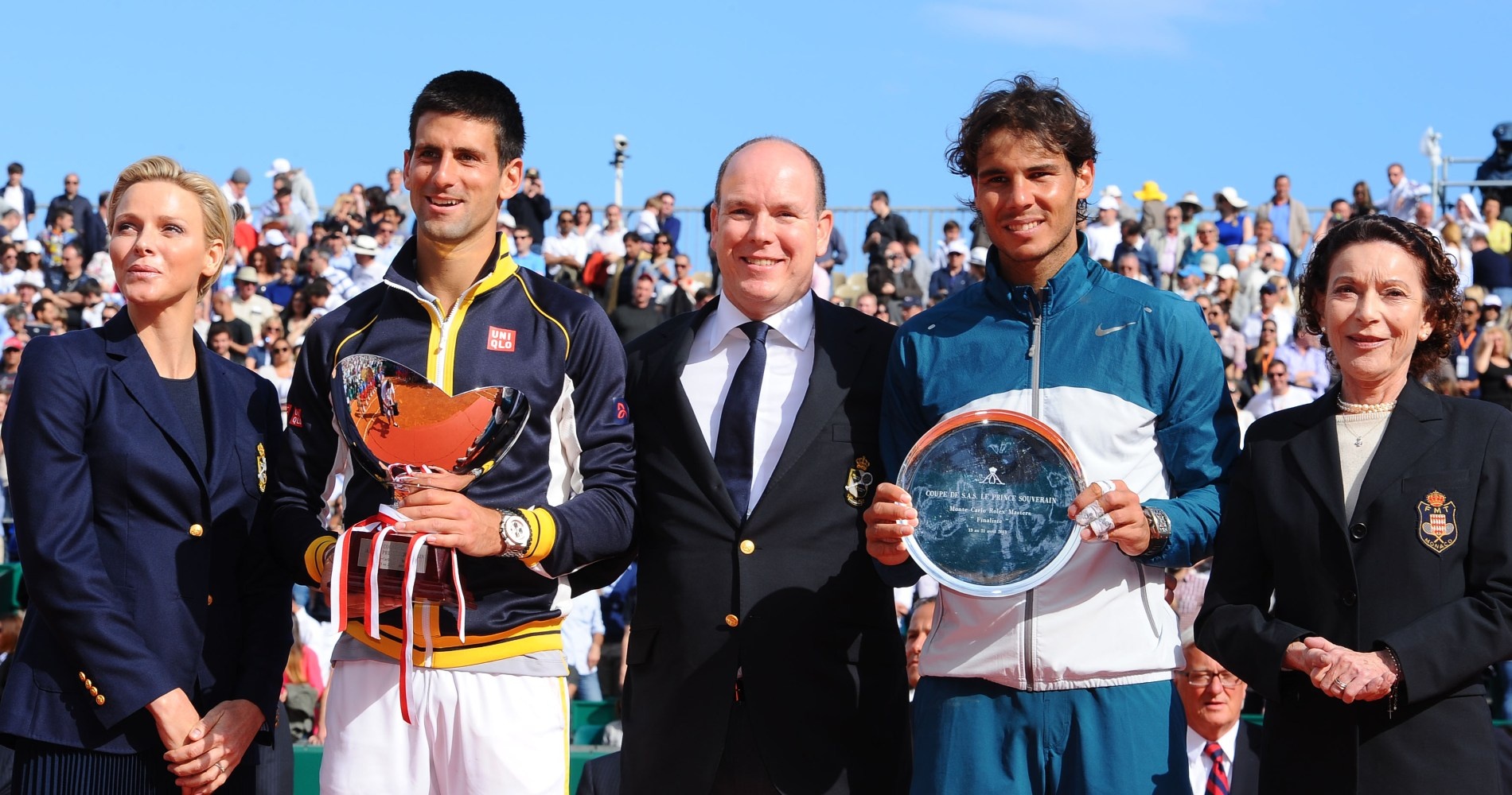 Novak Djokovic and Rafael Nadal pose with their trophies after the 2013 final.