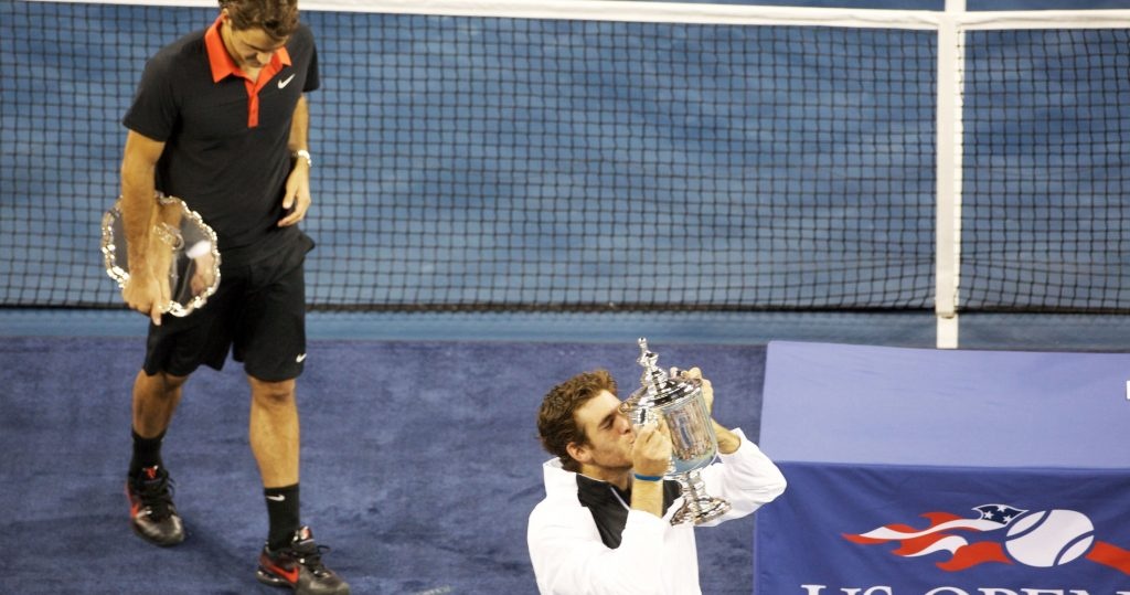 2009 US Open winner Juan Martin Del Potro with runner-up Roger Federer in the back