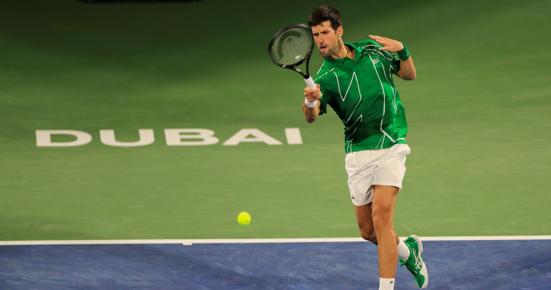Djokovic is hitting a forehand Dubai 2020 Khachanov