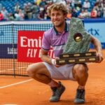 Casper Ruud of Norway receives during the award ceremony, the trophy at the Gstaad Swiss Open ATP Tour 250 Series 2021 tournament