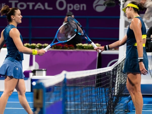 Maria Sakkari of Greece & Garbine Muguruza of Spain at the net after the quarter-final at the 2021 Qatar Total Open WTA 500 tournament