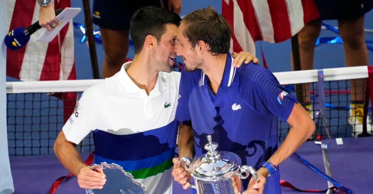 Novak Djokovic, of Serbia, talks with Daniil Medvedev, of Russia, during the trophy presentation after the men's singles final at the 2021 U.S. Open tennis tournament