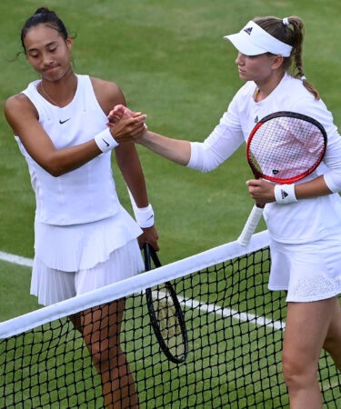 Elena Rybakina shakes hands with China's Qinwen Zheng after winning their third round match at Wimbledon 2022