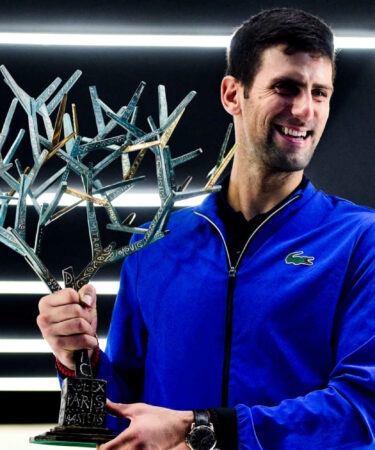 Novak Djokovic with the winner's trophy at the Paris Masters