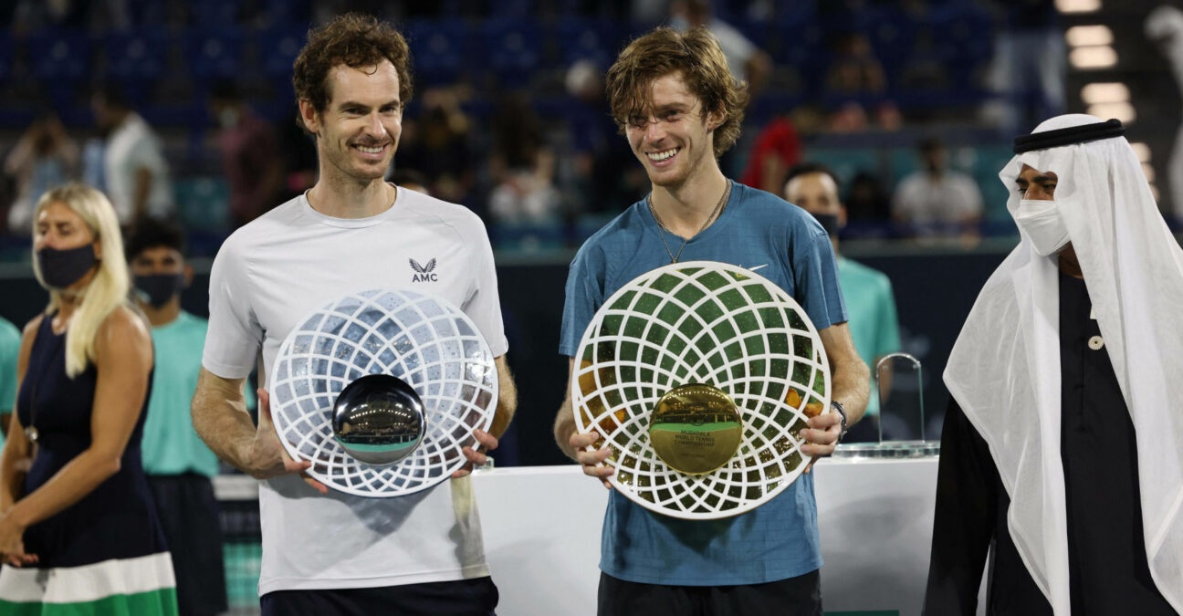 Andrey Rublev and Andy Murray with their trophies at the 2021 Mubadala World Tennis Championship