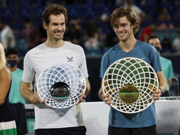 Andrey Rublev and Andy Murray with their trophies at the 2021 Mubadala World Tennis Championship