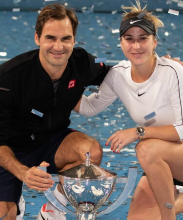 Roger Federer and Belinda Bencic with the 2019 Hopman Cup trophy