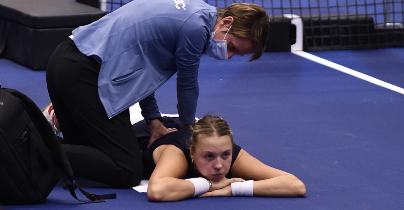 Anett Kontaveit of Estonia has her back treated during a break at the WTA Agel Open 2022 in Ostrava, Czech Republic