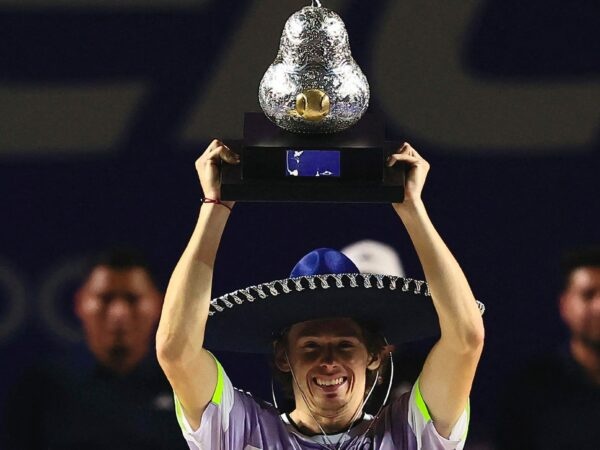 Australia's Alex de Minaur celebrates with the trophy after winning the Mexican Open