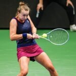 Barbora Krejcikova is hitting a return agains Belina Bencic dureing their semi-final in Tallinn in 2022.