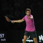Gilles Simon hits a forehand in the dark at the Rennes Open in 2022