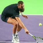 Benoît Paire hits a backhand volley during a match at the Challenger of Rennes in 2022