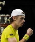 Alex De Minaur celebrates fist Davis Cup trophy Marin Cilic indoor cap