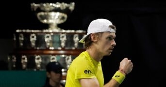 Alex De Minaur celebrates fist Davis Cup trophy Marin Cilic indoor cap