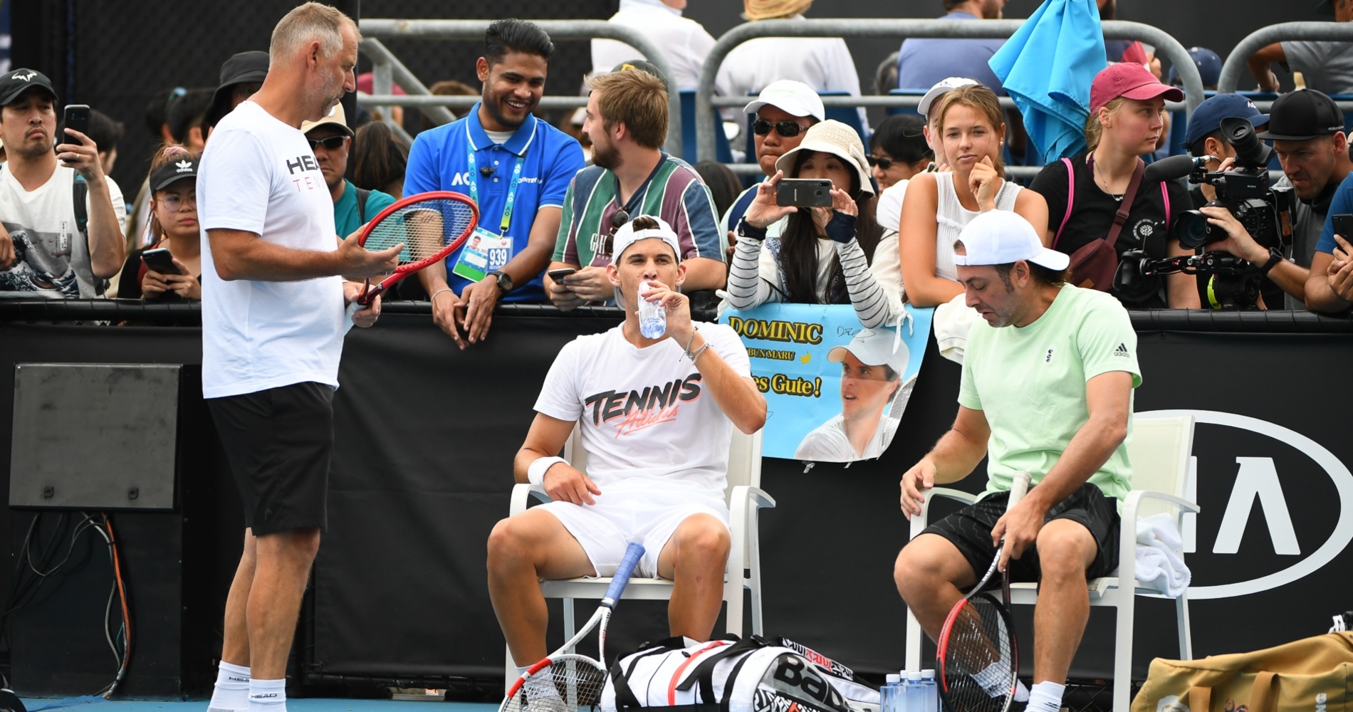 Dominic Thiem surrounded by Thomas Muster and Nicolas Massu at the 2020 Australian Open