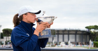 Iga Swiatek of Poland poses with her champions trophy after winning the final in Rome