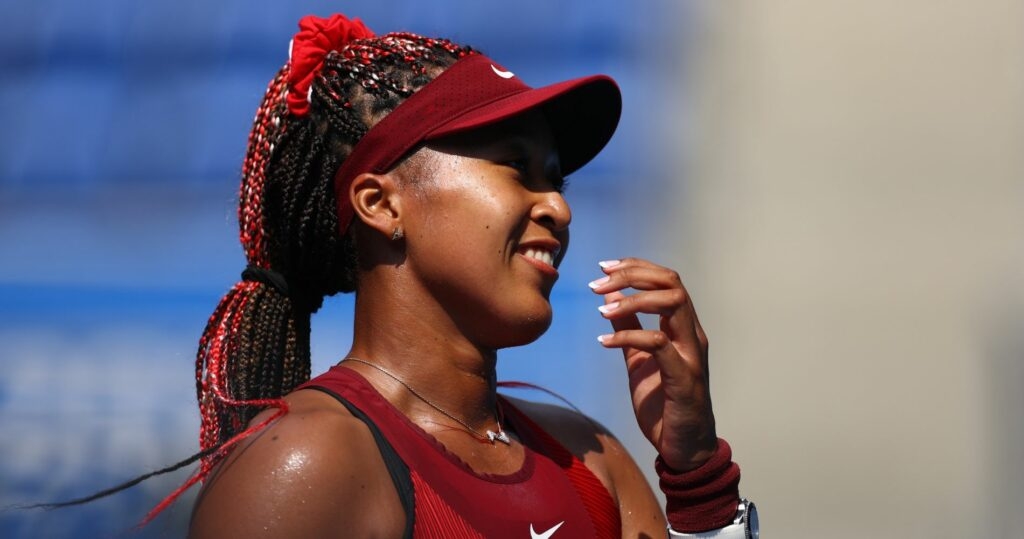 Ariake Tennis Park - Tokyo, Japan - July 25, 2021. Naomi Osaka of Japan celebrates after winning her first round match against Zheng Saisai of China