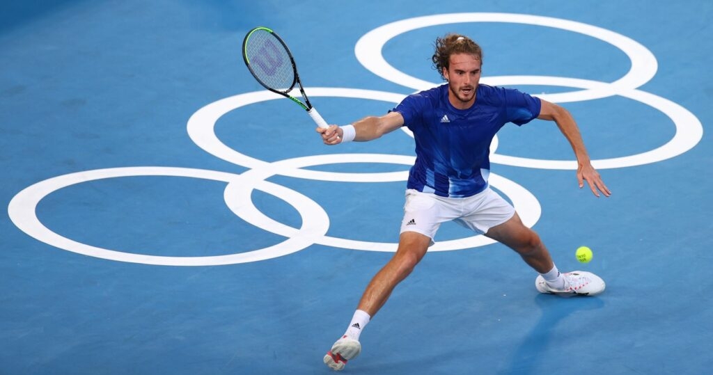 mpics - Tennis - Men's Singles - Round 1 - Ariake Tennis Park - Tokyo, Japan - July 25, 2021. Stefanos Tsitsipas of Greece in action during his first round match against Philipp Kohlschreiber of Germany REUTERS/Edgar Su / Panoramic