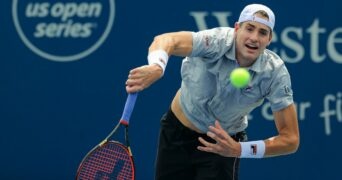 John Isner (USA) serves the ball against Cameron Norrie (GBR) during the Western and Southern Open tennis tournament at Lindner Family Tennis Center