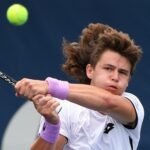 J.J. Wolf of the United States plays a shot against Frances Tiafoe of the United States in first round qualifying play for the National Bank Open at the Aviva Centre.