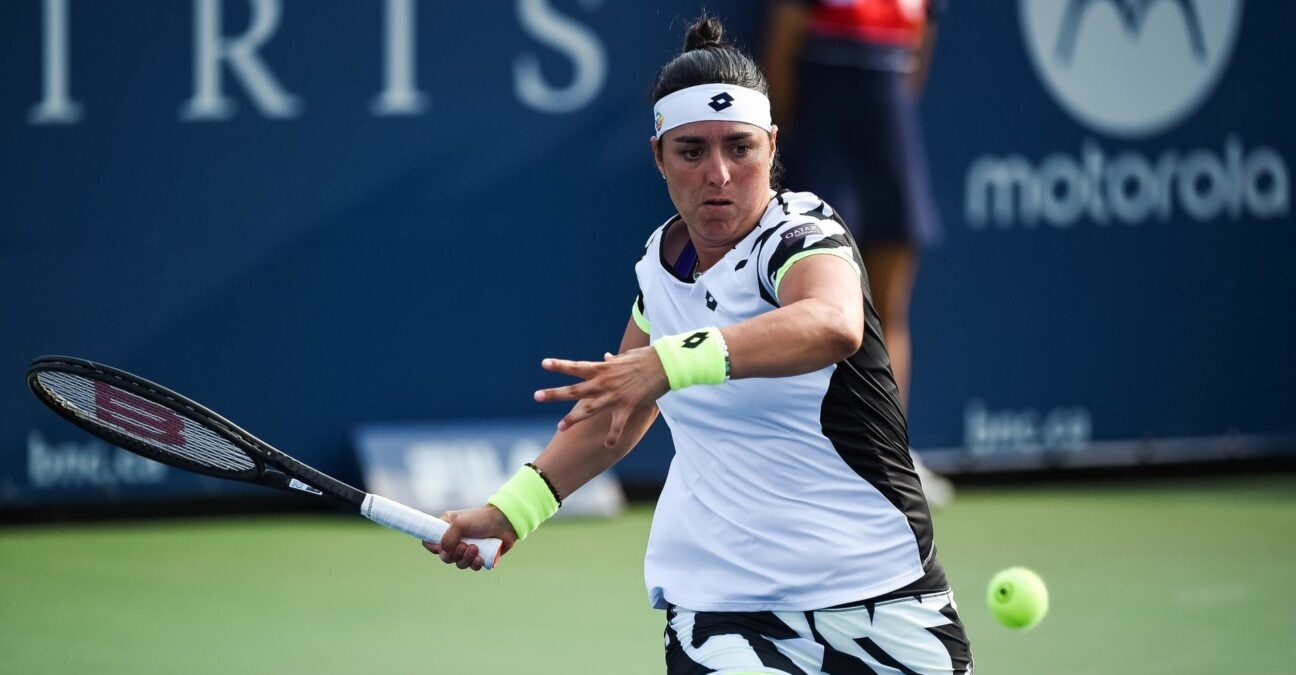 MONTREAL, QC - AUGUST 09: Ons Jabeur (TUN) returns the ball during the first round WTA National Bank Open match on August 9, 2021 at IGA Stadium in Montreal, QC