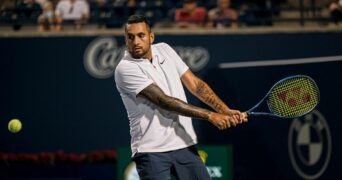 Nick Kyrgios returns a ball from the United States' Reilly Opelka during National Bank Open men's tennis action, in Toronto, Monday, Aug. 9, 2021.