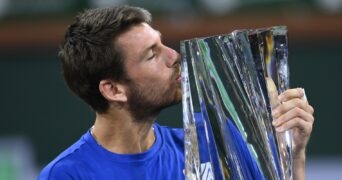 Cameron Norrie (GBR) holds the championship trophy after defeating Nikoloz Basilashvili (GEO) in the men's final in the BNP Paribas Open at the Indian Wells Tennis Garden.