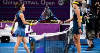 Maria Sakkari of Greece & Garbine Muguruza of Spain at the net after the quarter-final at the 2021 Qatar Total Open WTA 500 tournament