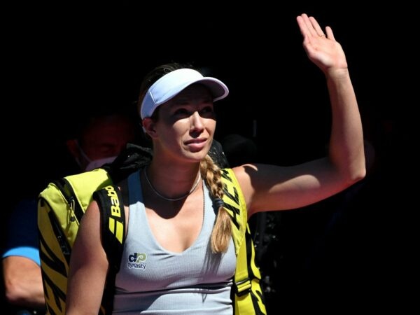 Danielle Collins of the U.S. waves at fans at the 2022 Australian Open