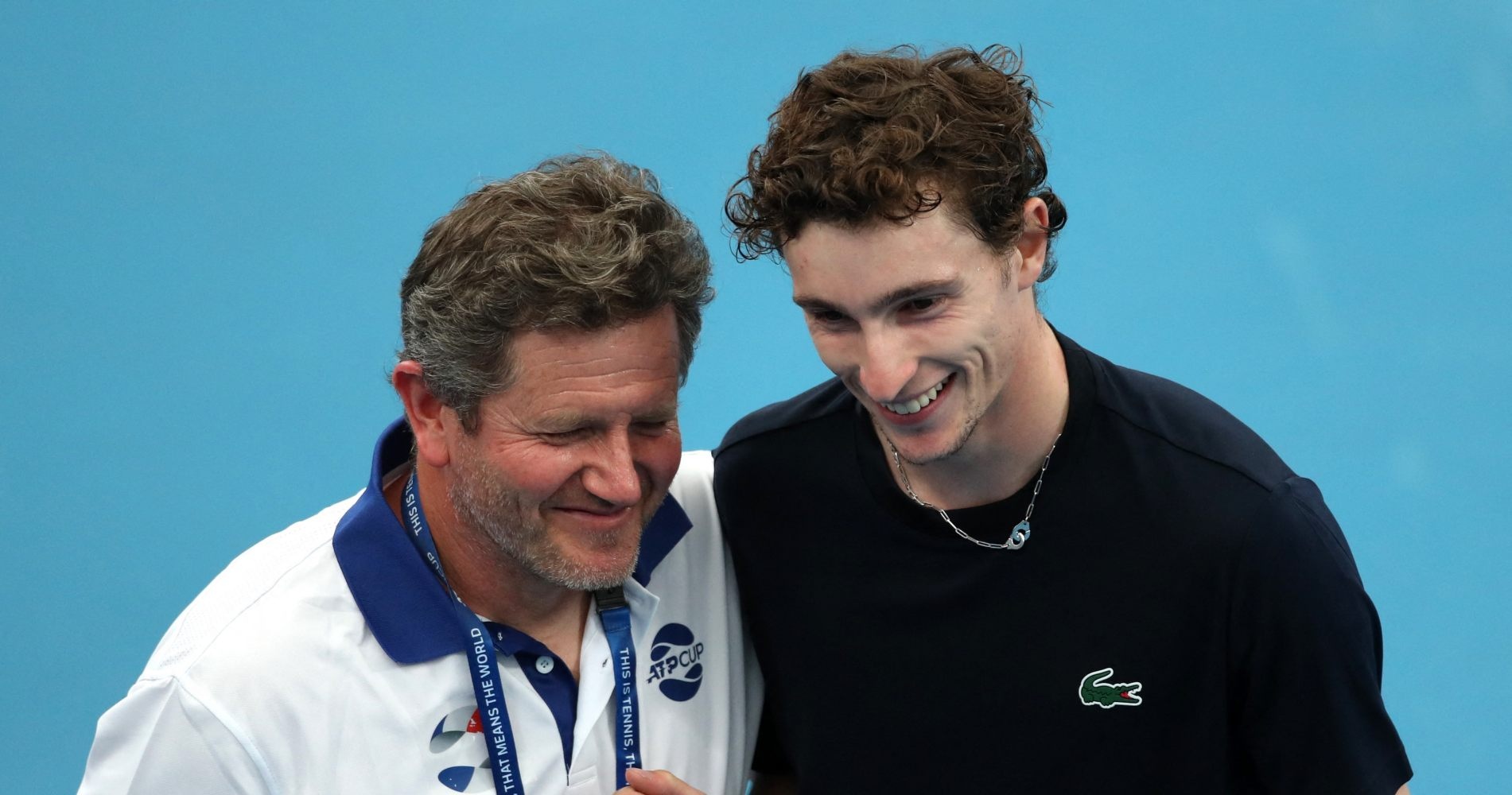 France's Ugo Humbert with French team captain Nicolas Copin after winning his group stage match against Russia's Daniil Medvedev