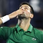 Serbia's Novak Djokovic celebrates winning his second round match at the Dubai Tennis Championships