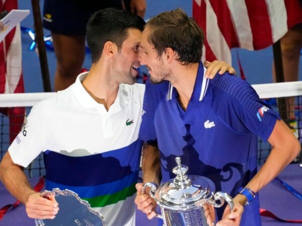 Novak Djokovic, of Serbia, talks with Daniil Medvedev, of Russia, during the trophy presentation after the men's singles final at the 2021 U.S. Open tennis tournament