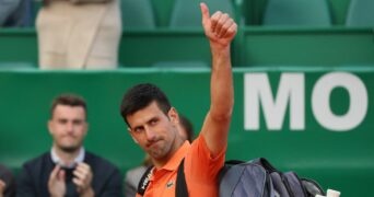 Novak Djokovic acknowledges spectators as he walks off the court after losing his second round match against Spain's Alejandro Davidovich Fokina at the Rolex Monte-Carlo Masters 2022