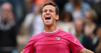 Argentina's Diego Sebastian Schwartzman celebrates after winning his third round match against Bulgaria's Grigor Dimitrov at the French Open