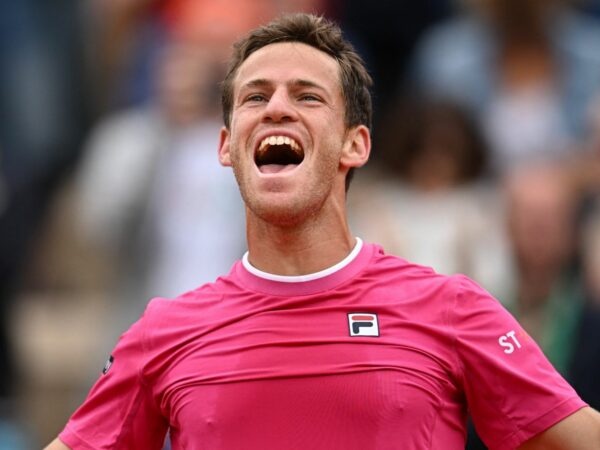 Argentina's Diego Sebastian Schwartzman celebrates after winning his third round match against Bulgaria's Grigor Dimitrov at the French Open