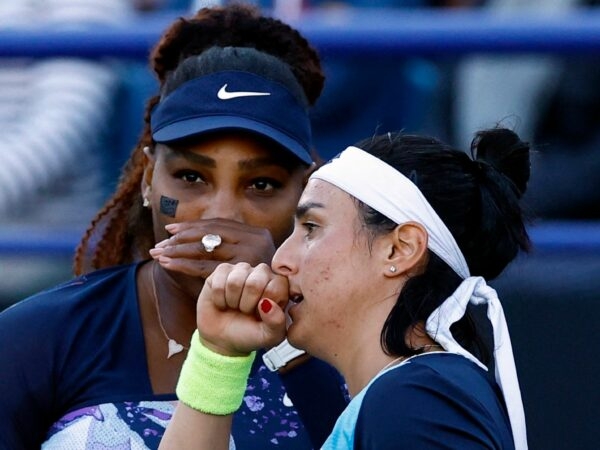 Serena Williams of the U.S. and Tunisia's Ons Jabeur after winning their double quarter final match at the Eastbourne International