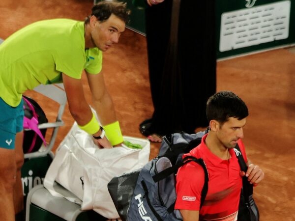 Serbia's Novak Djokovic walks off dejected after losing his quarter final match against Spain's Rafael Nadal at Roland Garros 2022