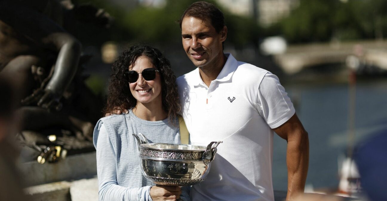 Spain's Rafael Nadal poses with his wife Maria Francisca Perello and the trophy after winning the men's singles French Open title
