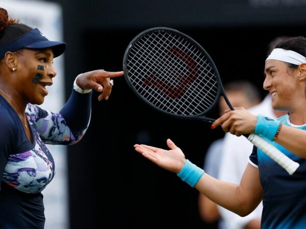 Serena Williams of the U.S. with Tunisia's Ons Jabeur during their round of 16 double match at Eastbourne International Tournament