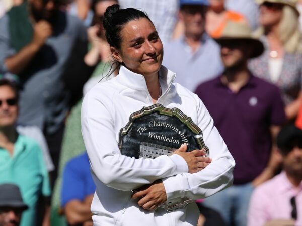 Ons Jabeur (TUN) poses with the runners up plate at the Wimbledon Championships