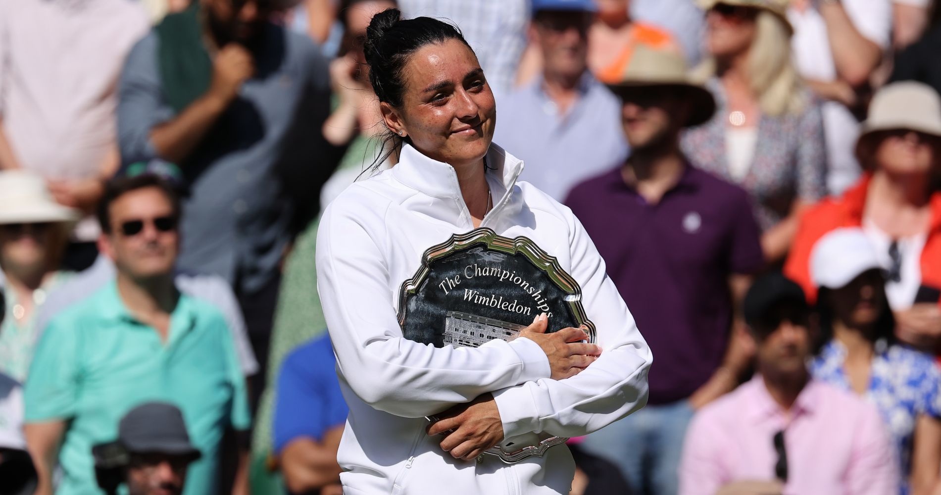 Ons Jabeur (TUN) poses with the runners up plate at the Wimbledon Championships