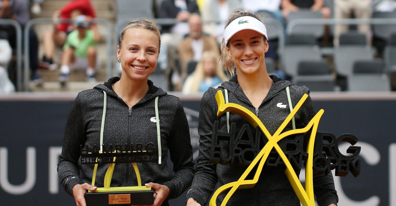 Bernarda Pera of the U.S. and Estonia's Anett Kontaveit pose with trophies after the women's singles final in Hamburg