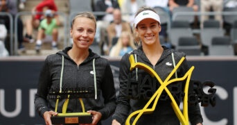 Bernarda Pera of the U.S. and Estonia's Anett Kontaveit pose with trophies after the women's singles final in Hamburg