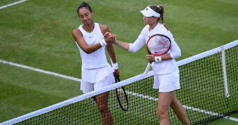 Elena Rybakina shakes hands with China's Qinwen Zheng after winning their third round match at Wimbledon 2022