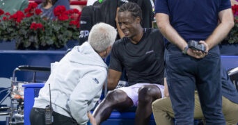 Gael Monfils gets medical attention during the 2022 National Bank Open in Montreal