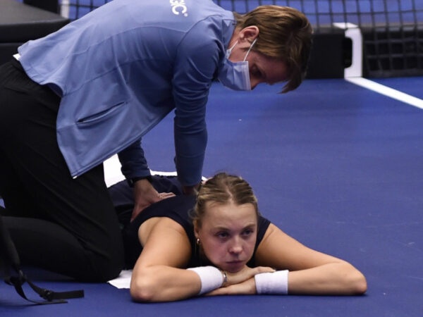 Anett Kontaveit of Estonia has her back treated during a break at the WTA Agel Open 2022 in Ostrava, Czech Republic