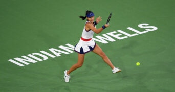 Emma Raducanu hits a shot against Aliaksandra Sasnovich at Indian Wells Tennis Garden in 2021