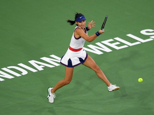 Emma Raducanu hits a shot against Aliaksandra Sasnovich at Indian Wells Tennis Garden in 2021