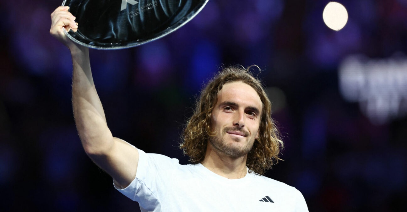 Stefanos Tsitsipas with the runners-up trophy after losing his final match against Serbia's Novak Djokovic at the 2023 Australian Open