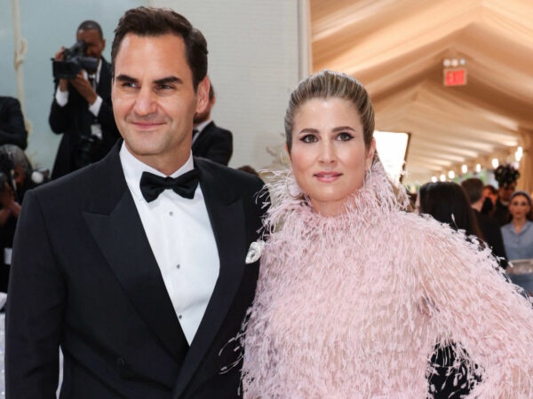 Roger Federer and his wife Mirka Federer pose at the Met Gala